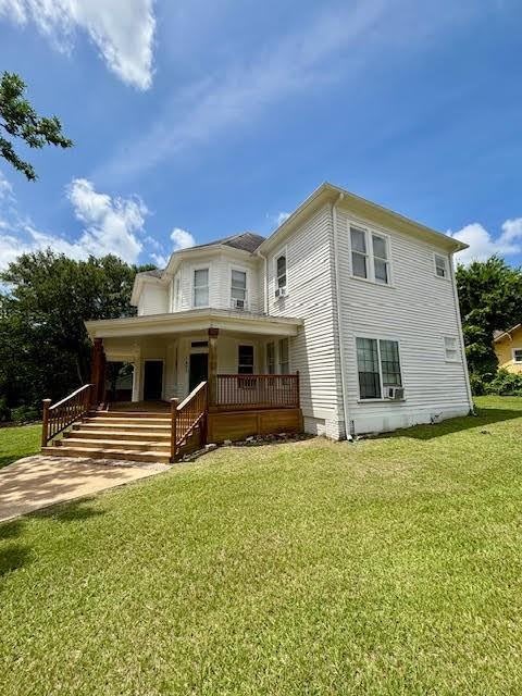 1403 14th Street, Unit 3 Huntsville, TX 77340 - Photo 2 of 9 a view of a house with a backyard porch and entertaining space