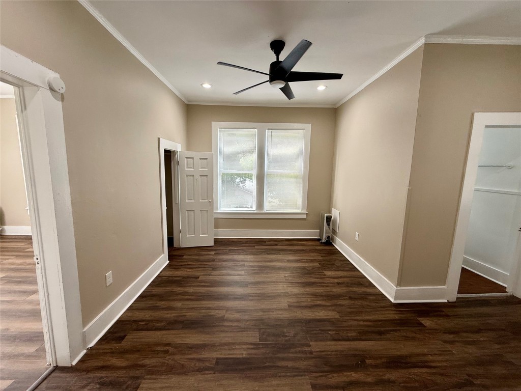 1403 14th Street, Unit 3 Huntsville, TX 77340 - Photo 5 of 9 a view of empty room with wooden floor and fan