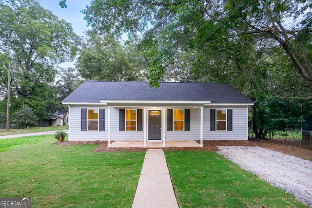 a front view of a house with yard
