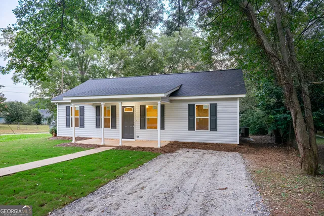 a front view of house with yard and green space