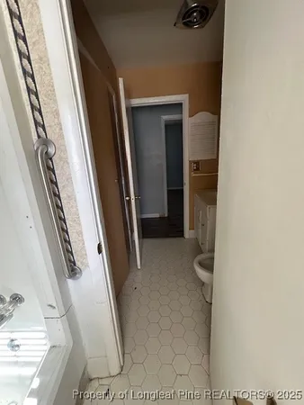a bathroom with a sink a toilet and tub
