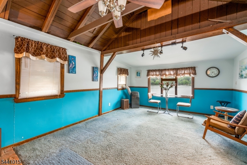 308 Lakeside Avenue Hopatcong, NJ 07821 - Photo 2 of 13 a bedroom with furniture and a window