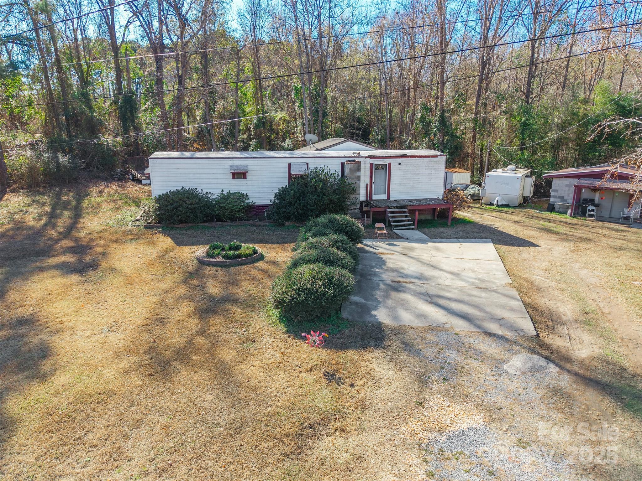 551 Arrowwood Road Great Falls, SC 29055 - Photo 6 of 12 a view of a house with backyard and sitting area