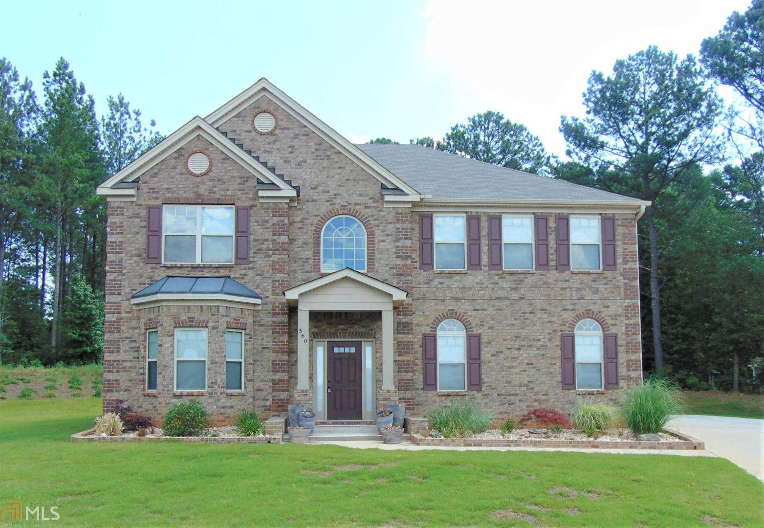 560 Aerial Avenue Stockbridge, GA 30281 - Photo 1 of 1 a front view of a house with a yard and garage