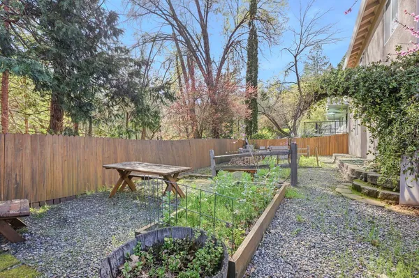 a backyard of a house with outdoor seating