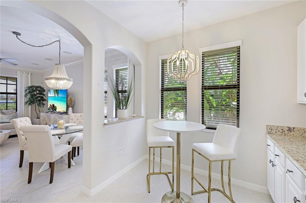 1423 Santiago Circle, Unit 1702 Naples, FL 34113 - Photo 12 of 46 a view of a dining room with furniture window and outside view
