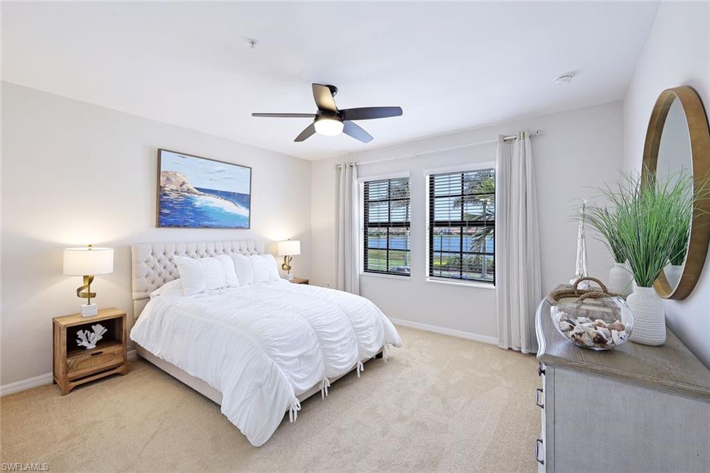 1423 Santiago Circle, Unit 1702 Naples, FL 34113 - Photo 14 of 46 a bedroom with a bed furniture and a window