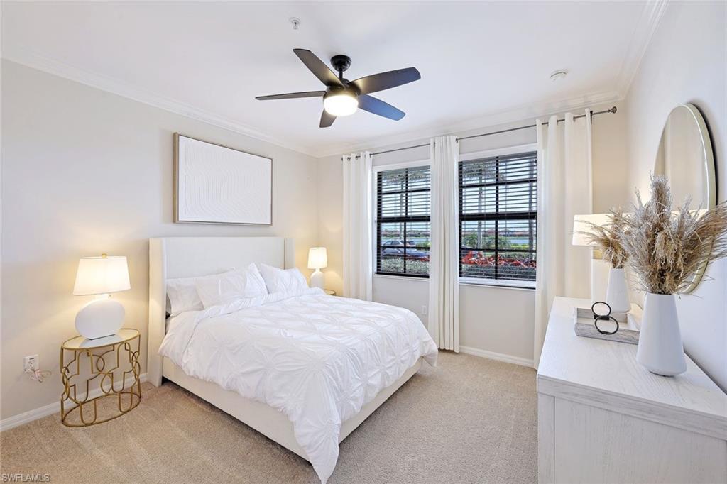 1423 Santiago Circle, Unit 1702 Naples, FL 34113 - Photo 16 of 46 a bedroom with a large bed and a potted plant
