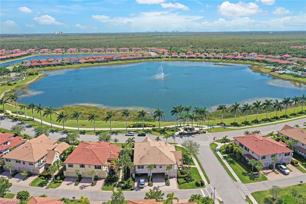 1423 Santiago Circle, Unit 1702 Naples, FL 34113 - Photo 2 of 46 an aerial view of residential houses with outdoor space