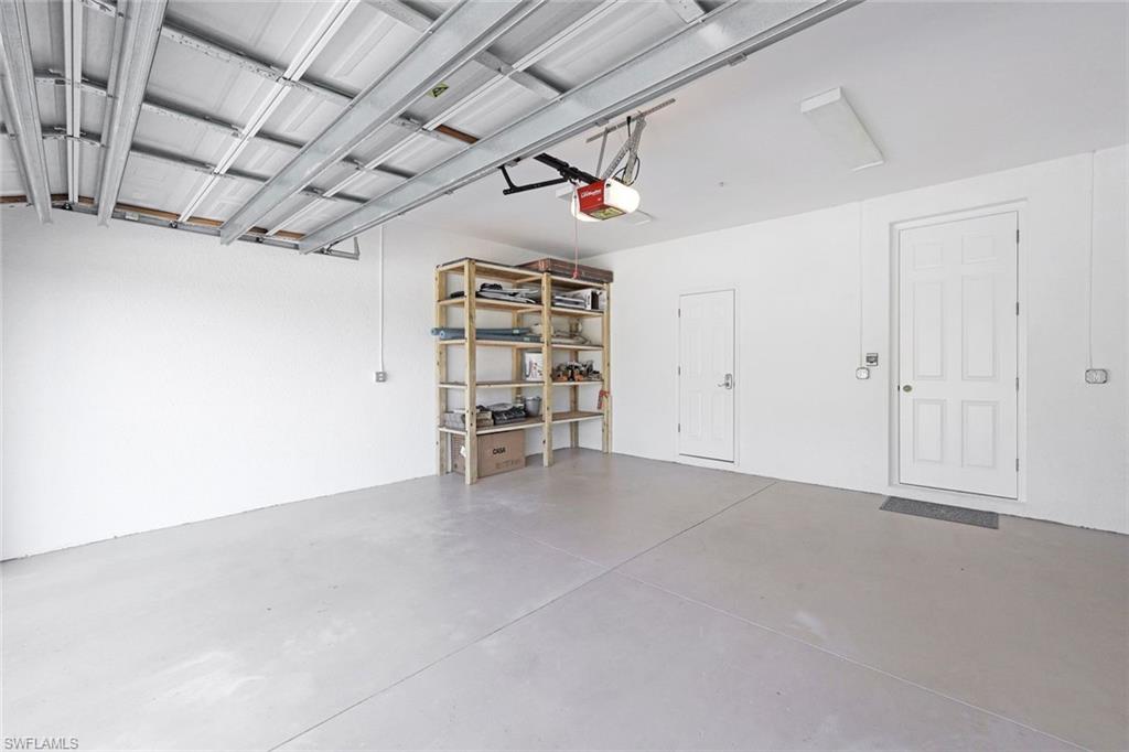 1423 Santiago Circle, Unit 1702 Naples, FL 34113 - Photo 23 of 46 an empty room with a empty space