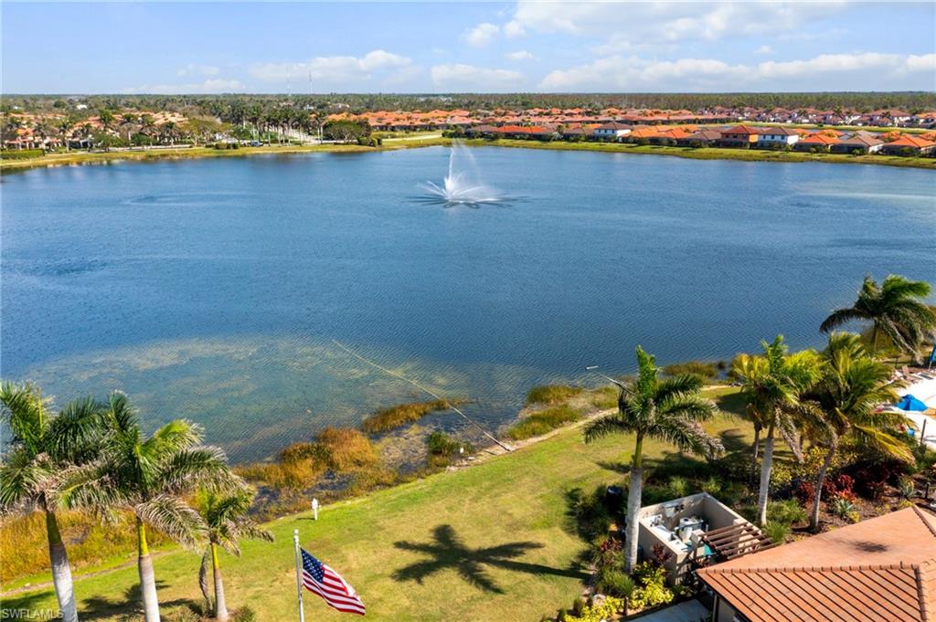 1423 Santiago Circle, Unit 1702 Naples, FL 34113 - Photo 40 of 46 a view of a lake with a city