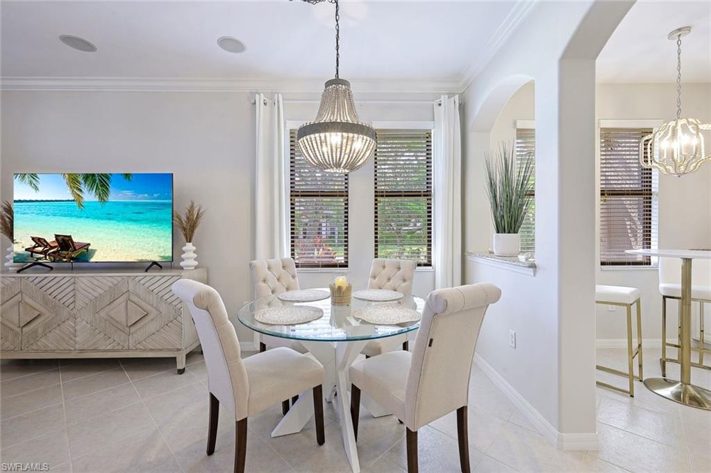 1423 Santiago Circle, Unit 1702 Naples, FL 34113 - Photo 6 of 46 a view of a dining room with furniture window and outside view