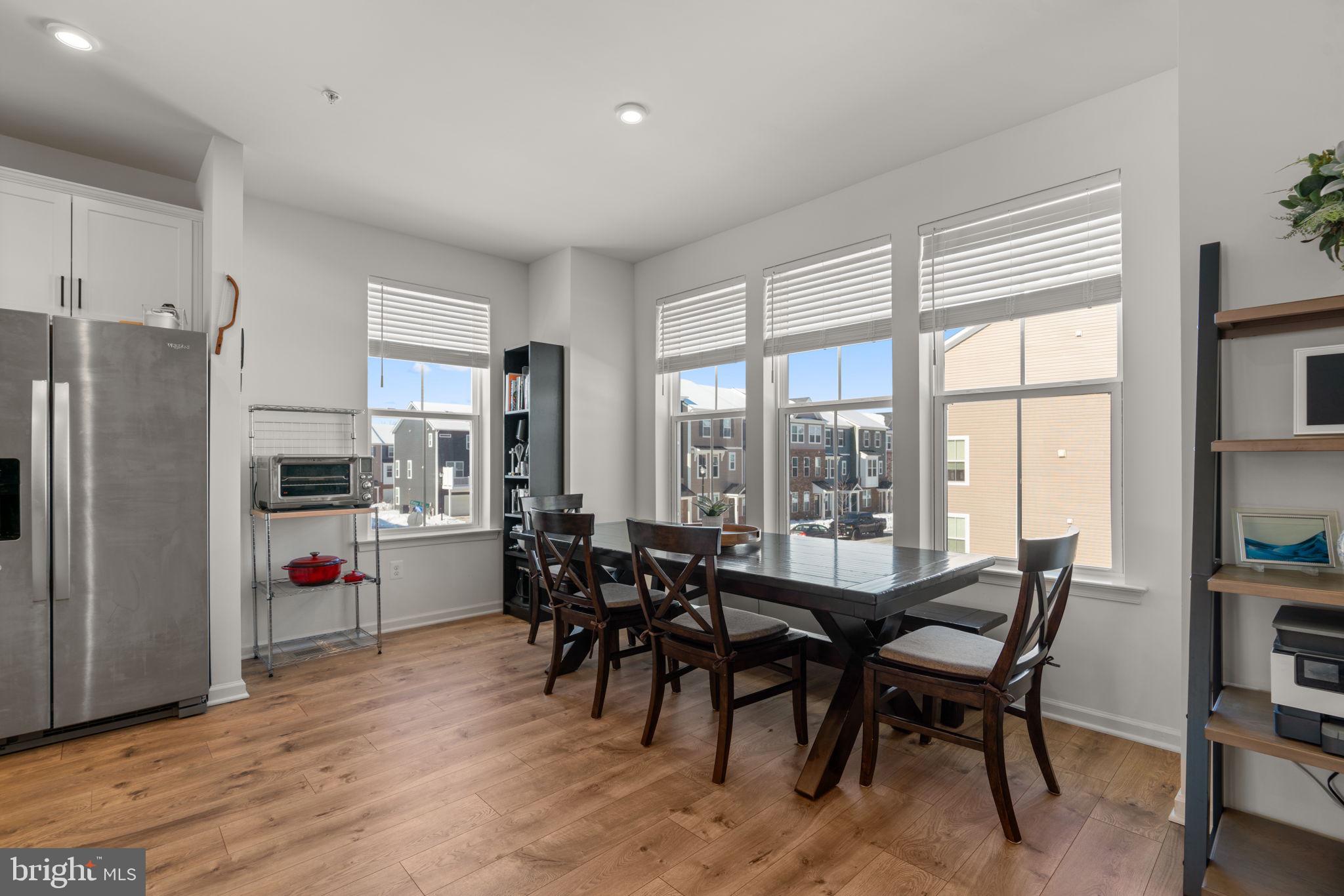 1605 Aster Lane Hanover, MD 21076 - Photo 16 of 44 a view of a dining room with furniture window and outside view