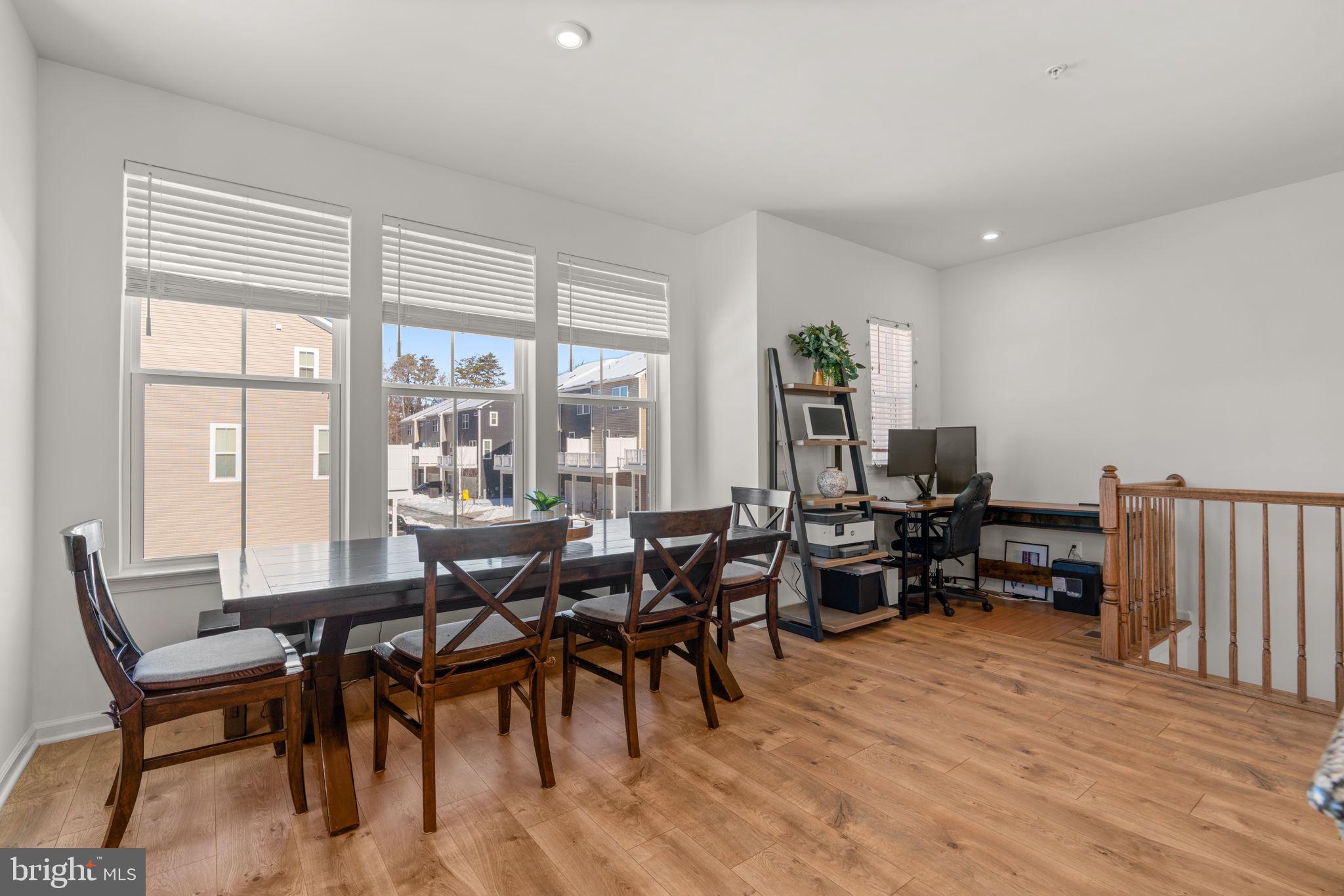 1605 Aster Lane Hanover, MD 21076 - Photo 17 of 44 a view of a dining room with furniture window and outside view