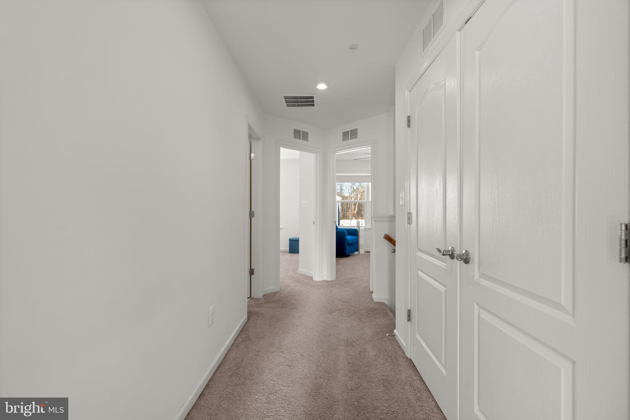 1605 Aster Lane Hanover, MD 21076 - Photo 27 of 44 a view of a hallway with a livingroom and a bathroom
