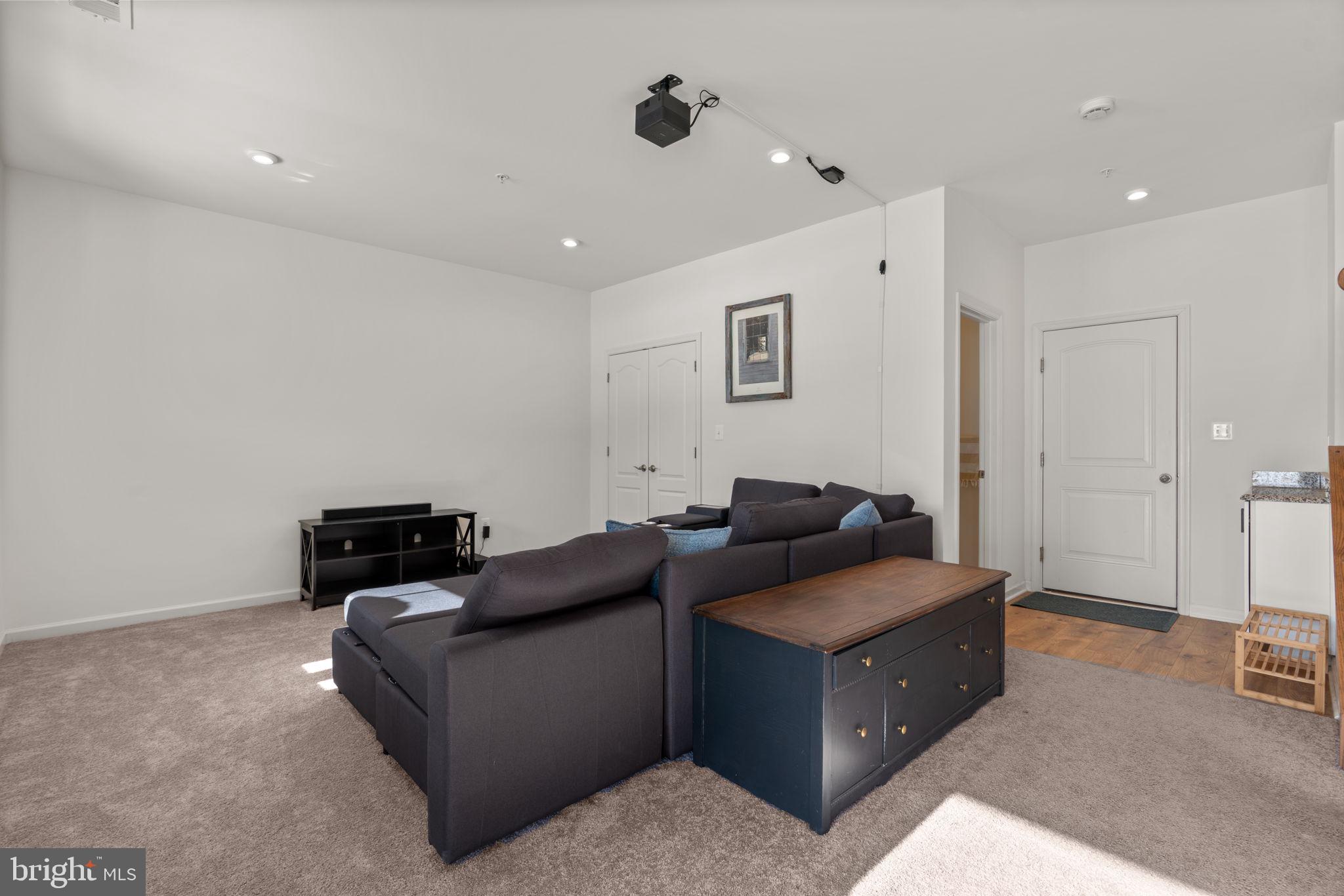 1605 Aster Lane Hanover, MD 21076 - Photo 34 of 44 a living room with furniture and a flat screen tv