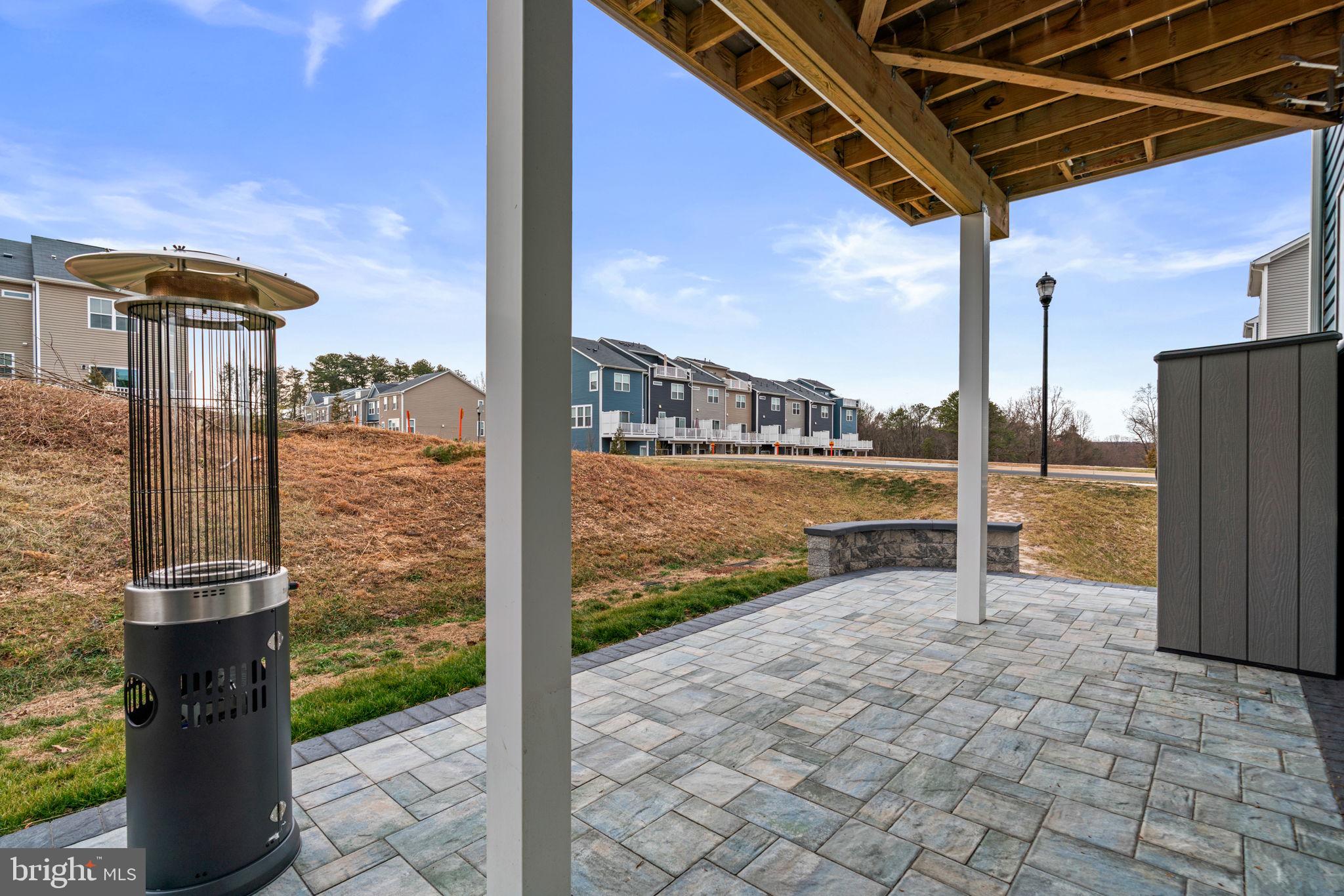 1605 Aster Lane Hanover, MD 21076 - Photo 39 of 44 a view of a patio with a table chairs and wooden fence
