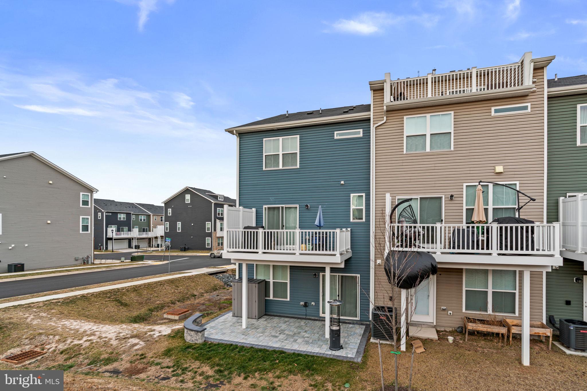 1605 Aster Lane Hanover, MD 21076 - Photo 40 of 44 a front view of a house with a yard