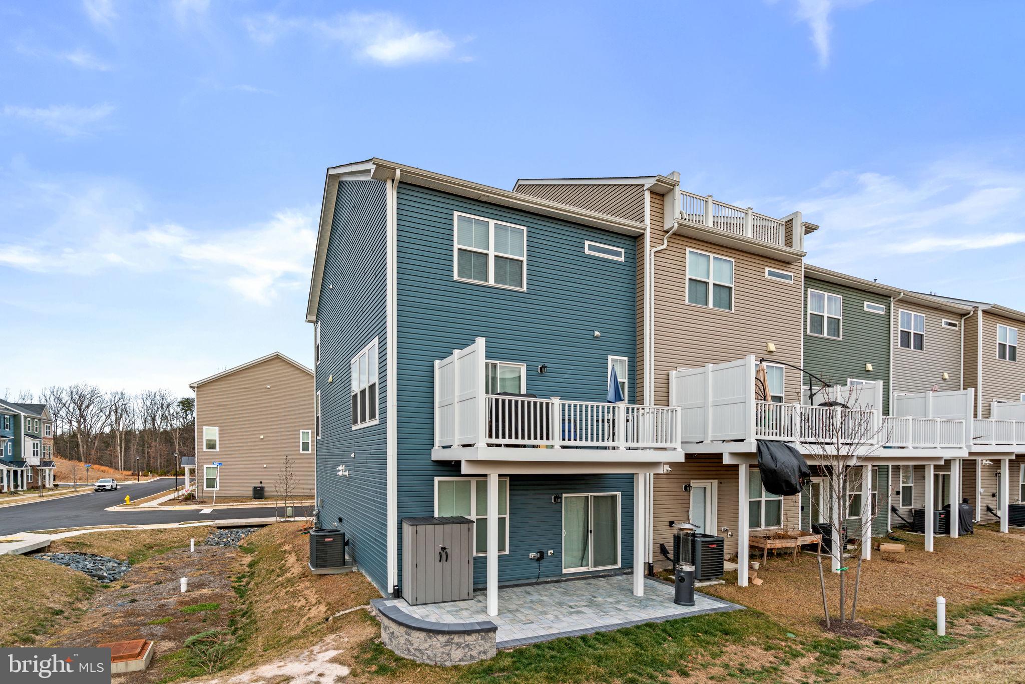 1605 Aster Lane Hanover, MD 21076 - Photo 42 of 44 a front view of a house with a yard