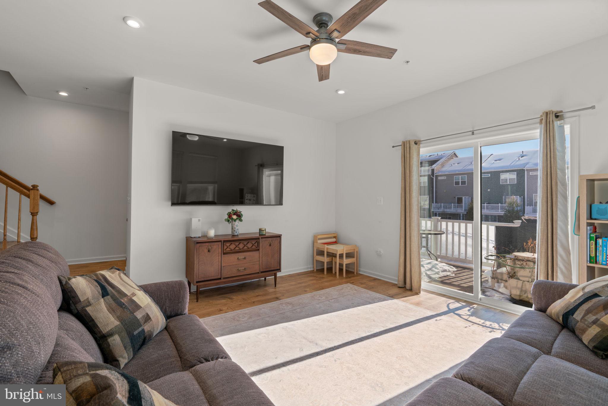 1605 Aster Lane Hanover, MD 21076 - Photo 5 of 44 a living room with furniture and a flat screen tv