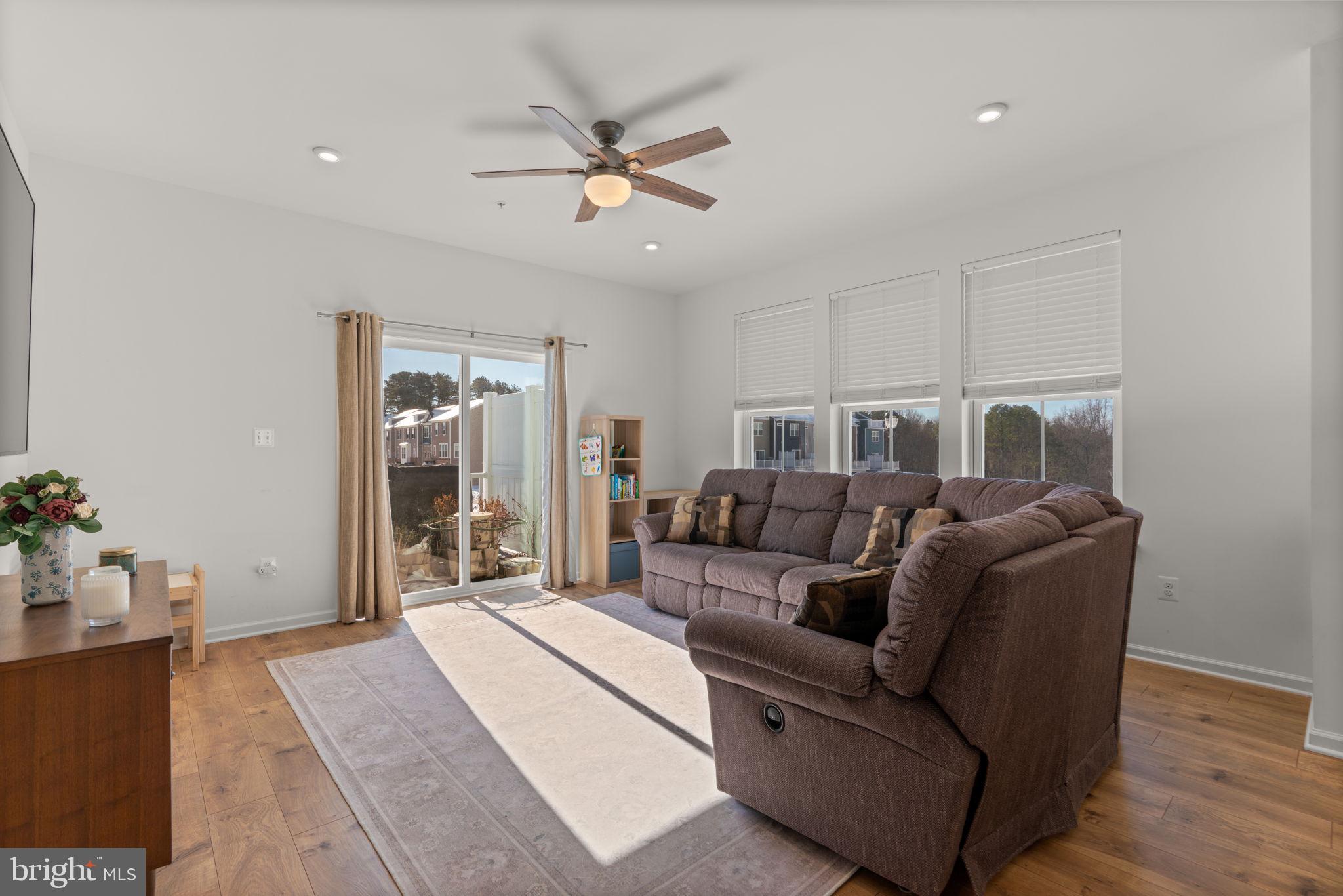 1605 Aster Lane Hanover, MD 21076 - Photo 6 of 44 a living room with furniture and a chandelier