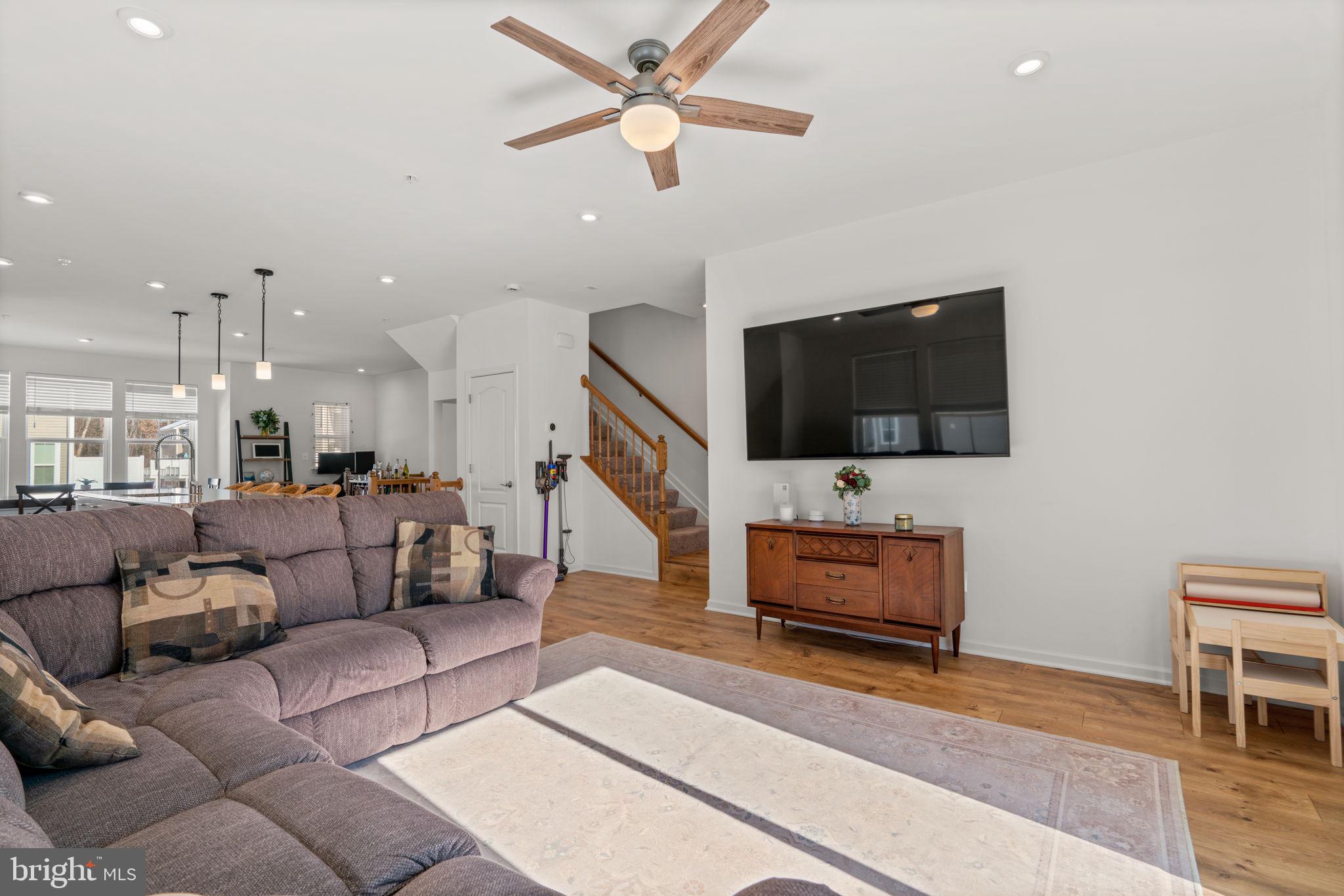 1605 Aster Lane Hanover, MD 21076 - Photo 7 of 44 a living room with furniture and a flat screen tv