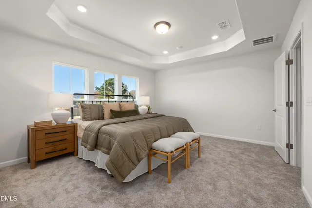 a bathroom with a granite countertop sink a toilet and a large mirror