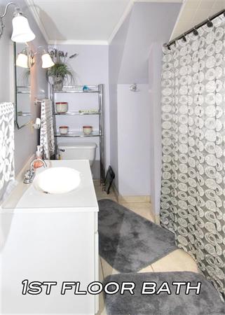 26 Granger Street Springfield, MA 01119 - Photo 11 of 18 a bathroom with a sink a toilet and shower