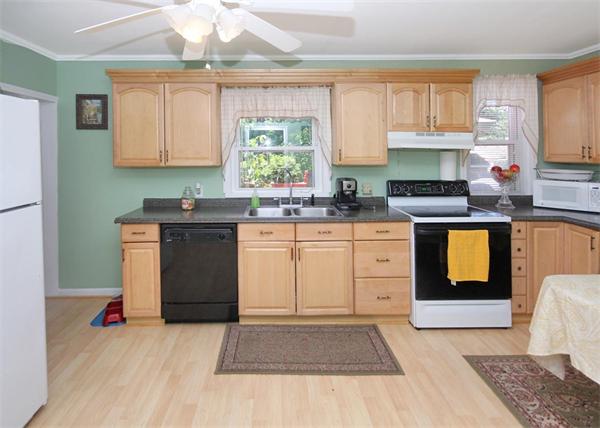 26 Granger Street Springfield, MA 01119 - Photo 5 of 18 a kitchen with a sink stove and cabinets