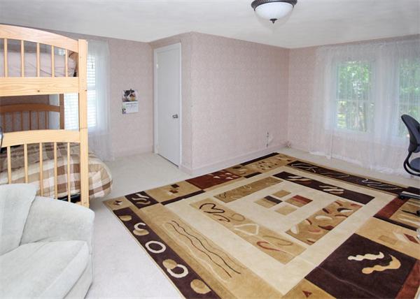 26 Granger Street Springfield, MA 01119 - Photo 9 of 18 a view of a bedroom with furniture and windows