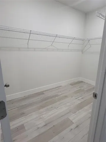 a bathroom with a sink a mirror and a shower