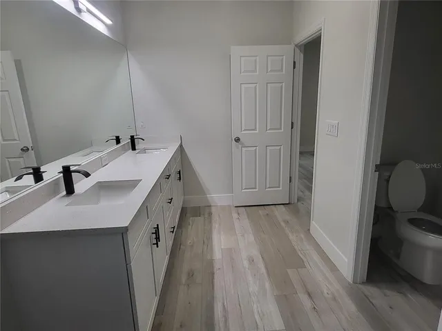 a bathroom with a sink and a shower