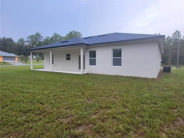 a house view with a backyard space
