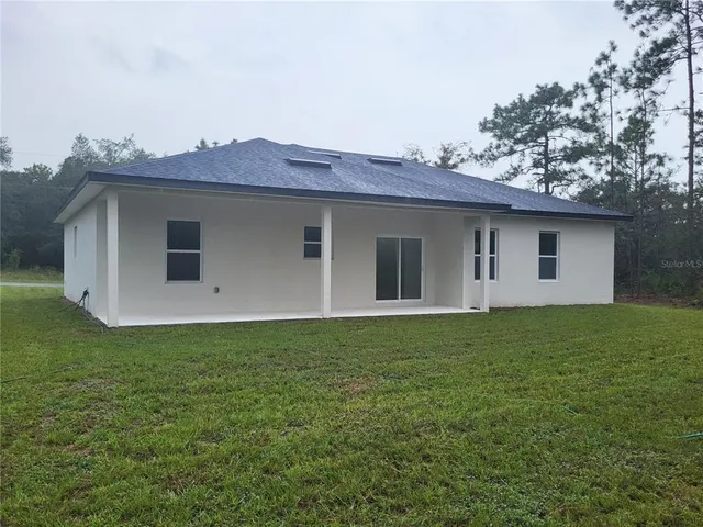 a view of a house with a garden