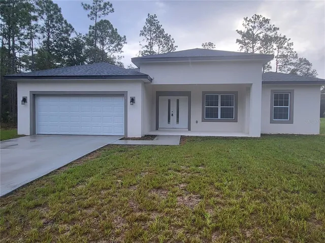 a kitchen with stainless steel appliances a refrigerator sink and microwave