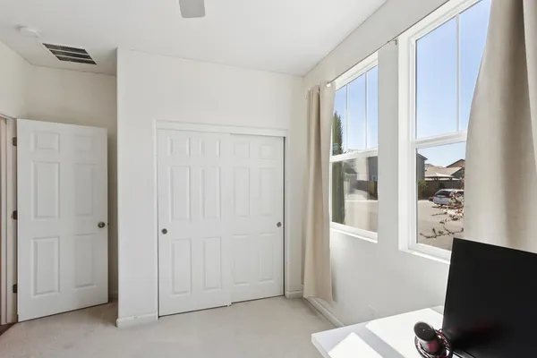 a view of a bathroom with a sink and a mirror
