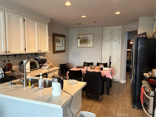 a living room with furniture a window and a flat screen tv