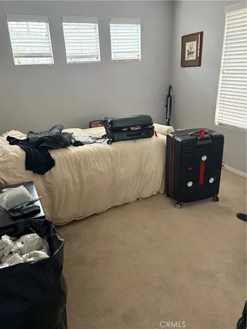 a room with a bed and a window