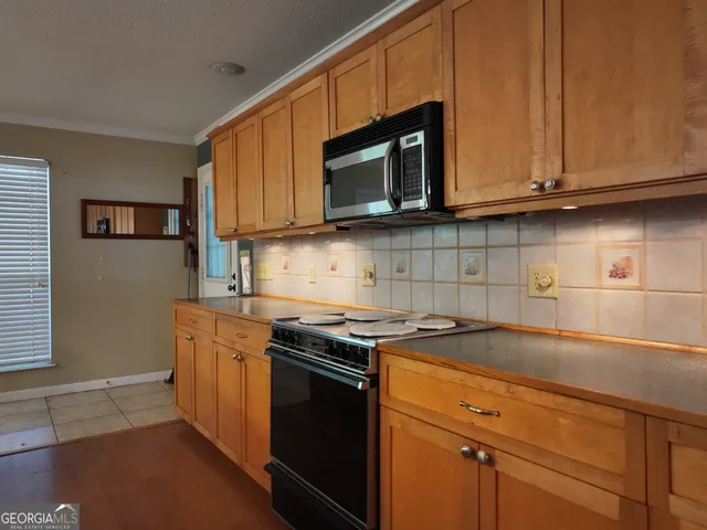 a bedroom with a bed and a gym equipment