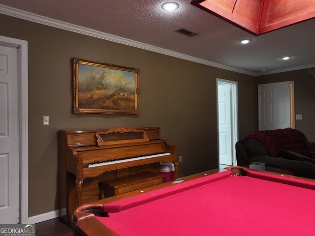 a room with furniture and a flat screen tv