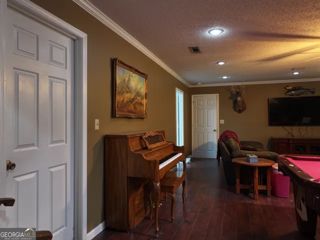 a view of a livingroom with furniture and a flat screen tv