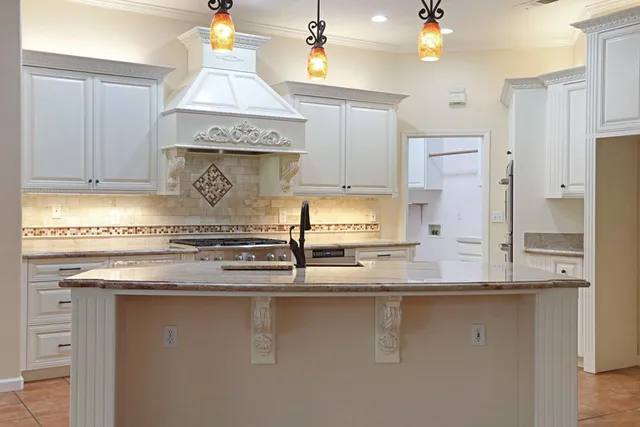 a kitchen with a stove and a sink