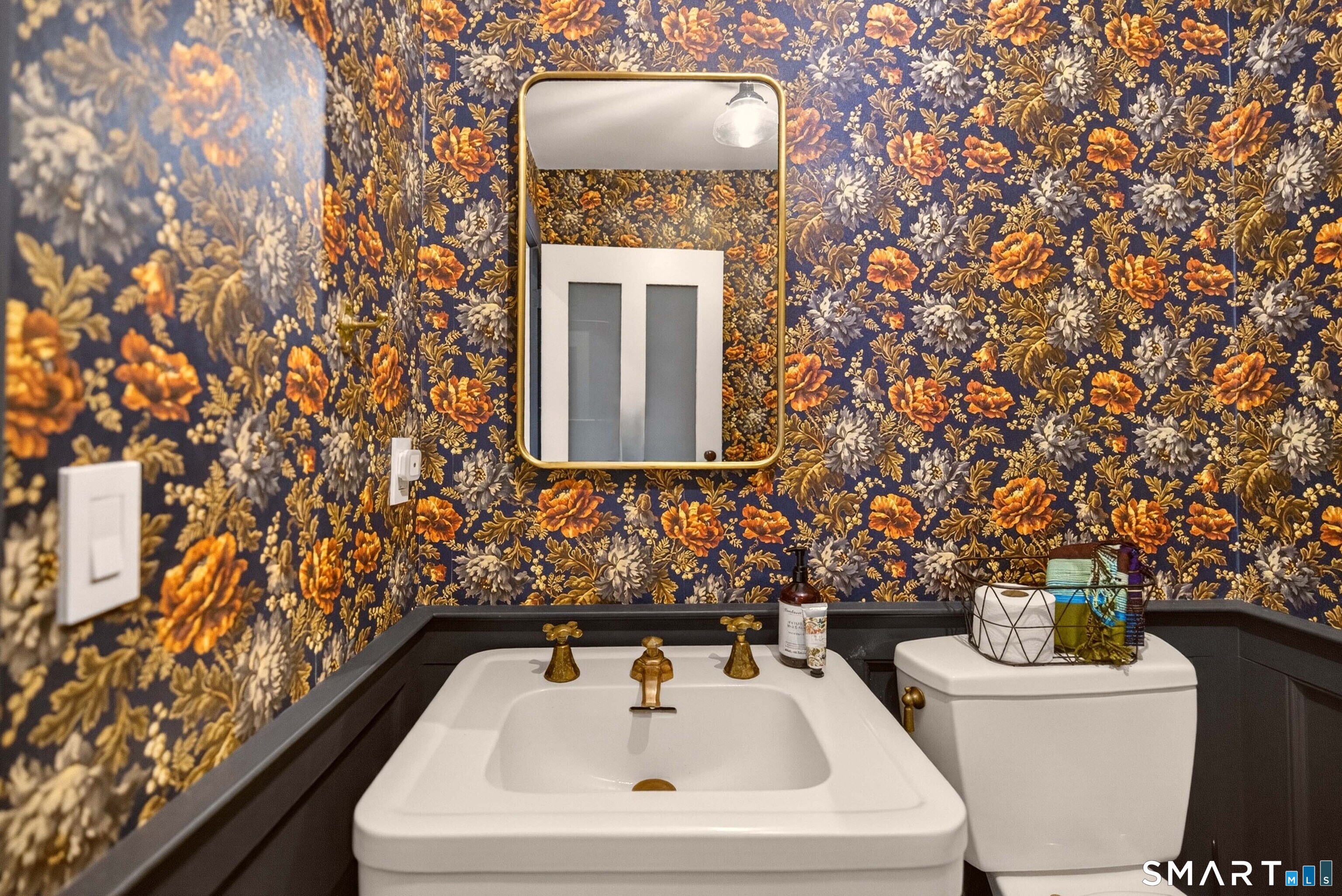100 North Main Street Kent, CT 06757 - Photo 35 of 40 a bathroom with a sink and mirror with toilet