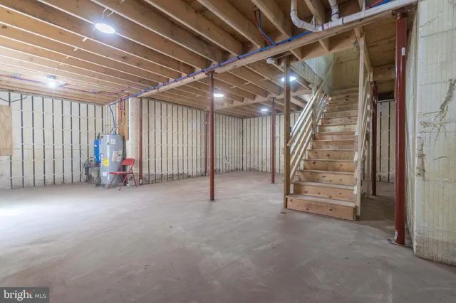 a view of an empty room with stairs