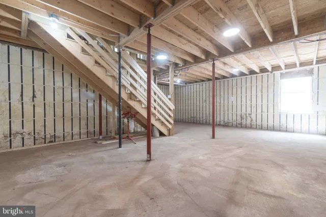 a view of an empty room with stairs