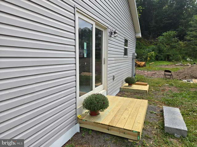 a backyard of a house with seating space