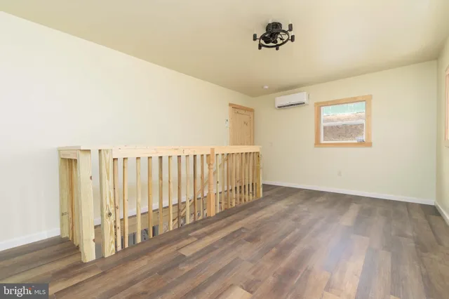 a view of entryway with wooden floor