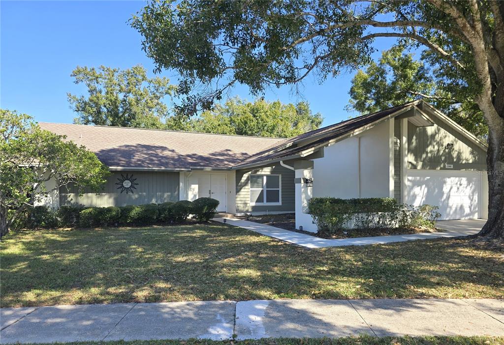 a view of a house with a yard