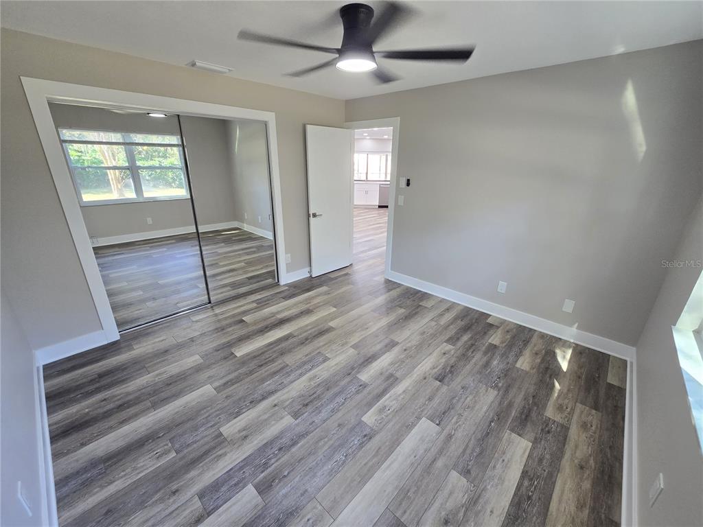 2940 Cypress Ridge Palm Harbor, FL 34684 - Photo 14 of 53 wooden floor in an empty room with a window