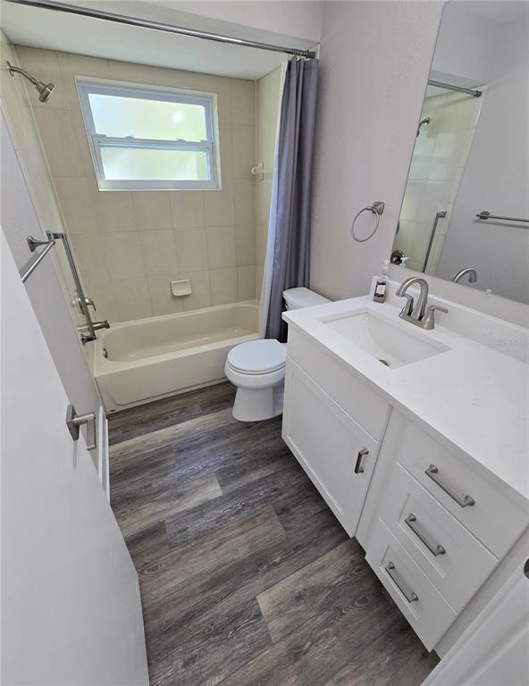 2940 Cypress Ridge Palm Harbor, FL 34684 - Photo 37 of 53 a bathroom with a sink a toilet and a mirror